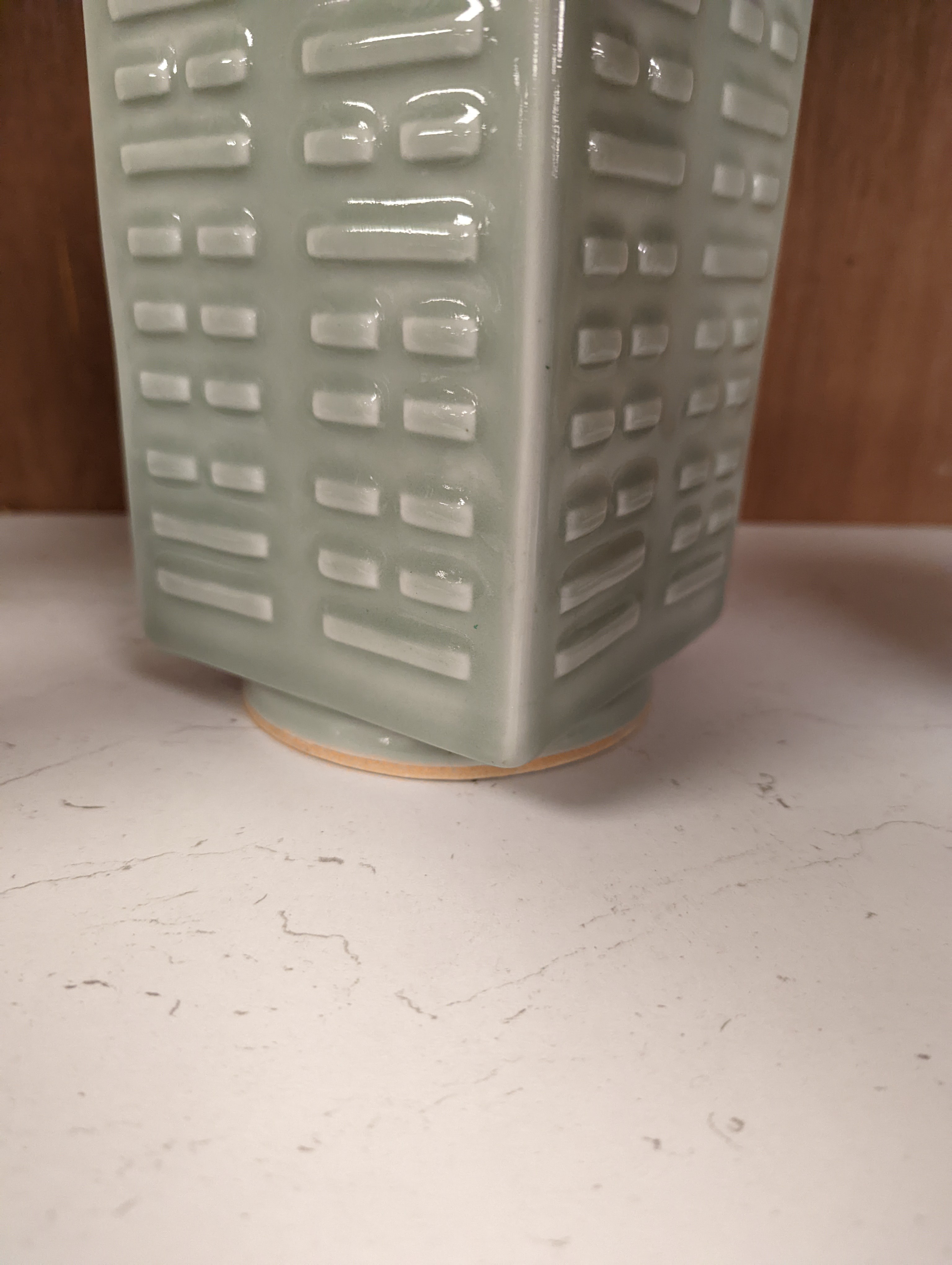 A Chinese celadon glazed eight trigrams cong shaped vase, Guangxu mark and possibly of the period. Provenance - owner bought in auction 20 years ago. 25cm tall